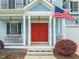 Inviting entryway features a bright red double door and classic architectural details at 101 Rustic Pine Ct, Apex, NC 27502