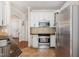 Bright kitchen with stainless steel appliances, white cabinets, and granite countertops, offering modern amenities at 101 Rustic Pine Ct, Apex, NC 27502