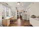 Versatile office area featuring natural light, a functional desk, and a glimpse into the walk-in closet at 101 Rustic Pine Ct, Apex, NC 27502