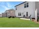 Lush green backyard with patio offers a serene outdoor living space and relaxing atmosphere at 1016 Mirbeck Ln, Durham, NC 27713