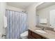 Full bathroom featuring a shower/tub combo with granite vanity and a curtained shower at 1016 Mirbeck Ln, Durham, NC 27713