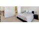 Cozy bedroom featuring plush carpet, neutral walls, and a connected bathroom at 1016 Mirbeck Ln, Durham, NC 27713