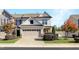 Charming townhouse featuring a two-car garage, stone accents, and well-maintained landscaping at 1016 Mirbeck Ln, Durham, NC 27713
