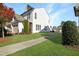Charming two-story home with lush green lawn, beautiful landscaping, and private driveway at 1016 Mirbeck Ln, Durham, NC 27713