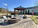Outdoor fire pit area with comfortable seating and gazebo, perfect for social gatherings at 1016 Mirbeck Ln, Durham, NC 27713