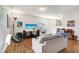 Comfortable living room featuring a large television, modern decor, and plenty of natural light at 1016 Mirbeck Ln, Durham, NC 27713
