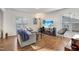Sun-drenched living room with hardwood floors, stylish furnishings, and inviting atmosphere at 1016 Mirbeck Ln, Durham, NC 27713