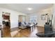 Bright living room features hardwood floors, modern furniture, and an open floor plan at 1016 Mirbeck Ln, Durham, NC 27713