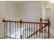 Stairwell featuring wooden railings and a view to the bedroom at 1016 Mirbeck Ln, Durham, NC 27713