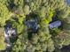 Aerial view of a home nestled among lush green trees at 104 Arcadia Ln, Chapel Hill, NC 27514