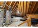 View of attic space with water heaters and exposed ductwork, showing mechanicals at 104 Arcadia Ln, Chapel Hill, NC 27514