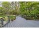 Back deck features gray decking, gray railings, and planters at 104 Arcadia Ln, Chapel Hill, NC 27514