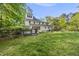 Well-manicured backyard and deck offer a private, relaxing outdoor space and green surroundings at 104 Arcadia Ln, Chapel Hill, NC 27514