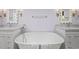 Elegant bathroom featuring a soaking tub between two vanities and decorative mirrors at 104 Arcadia Ln, Chapel Hill, NC 27514