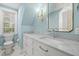 Stylishly renovated bathroom with Carrara marble countertops, wainscoting and chrome fixtures at 104 Arcadia Ln, Chapel Hill, NC 27514