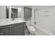 Updated bathroom with grey vanity, marble countertop, subway tile and brushed nickel fixtures at 104 Arcadia Ln, Chapel Hill, NC 27514