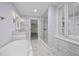 Stylish bathroom with glass shower, vanity, and tub, offering a relaxing retreat at 104 Arcadia Ln, Chapel Hill, NC 27514