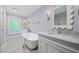 Luxurious bathroom with freestanding tub, double vanities, and decorative mirrors at 104 Arcadia Ln, Chapel Hill, NC 27514