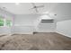 Carpeted upstairs bedroom has a dormer window and built in shelving at 104 Arcadia Ln, Chapel Hill, NC 27514