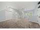 A spacious carpeted bonus room provides flexible space with natural light and a nearby bathroom at 104 Arcadia Ln, Chapel Hill, NC 27514