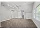 Large bedroom featuring an open floor plan, plush carpet, and a ceiling fan at 104 Arcadia Ln, Chapel Hill, NC 27514