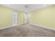 Bright bedroom with plush carpet, light-colored walls, and access to an ensuite bathroom at 104 Arcadia Ln, Chapel Hill, NC 27514