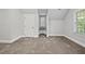 Bright, carpeted bedroom features window seat, dormer window, and ample natural light at 104 Arcadia Ln, Chapel Hill, NC 27514