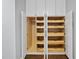 The open closet has white cabinet with wooden shelves, racks and lots of storage space at 104 Arcadia Ln, Chapel Hill, NC 27514