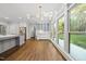 Dining area with bright lighting that connects to the kitchen and backyard deck at 104 Arcadia Ln, Chapel Hill, NC 27514