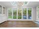 Bright dining area featuring ample windows with backyard views and modern light fixture at 104 Arcadia Ln, Chapel Hill, NC 27514