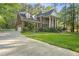 Beautiful brick home with stately columns, manicured lawn, and attached garage at 104 Arcadia Ln, Chapel Hill, NC 27514