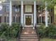 Welcoming front entrance with a brick staircase leading to double doors and classic architectural details at 104 Arcadia Ln, Chapel Hill, NC 27514