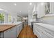 Spacious kitchen featuring stainless steel appliances and island that connects to living area at 104 Arcadia Ln, Chapel Hill, NC 27514