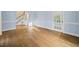 This spacious living room offers wood floors, large windows and neutral paint at 104 Arcadia Ln, Chapel Hill, NC 27514