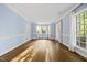 This living room features hardwood floors, classic trim, neutral paint, and lots of natural light at 104 Arcadia Ln, Chapel Hill, NC 27514