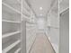 Large walk-in closet featuring custom shelving, drawers, and ample storage space at 104 Arcadia Ln, Chapel Hill, NC 27514