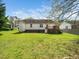 Enjoy this backyard with lush lawn, mature trees, and a convenient deck perfect for outdoor entertaining and relaxation at 104 Hamby Ct, Garner, NC 27529