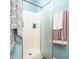 Bathroom featuring walk-in shower, neutral tile, and glass door at 104 Hamby Ct, Garner, NC 27529