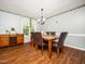 Elegant dining room with hardwood floors, stylish chandelier, and comfortable seating for Gathering gatherings at 104 Hamby Ct, Garner, NC 27529