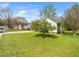 Charming home exterior with a well-manicured lawn and a blooming tree in a peaceful neighborhood setting at 104 Hamby Ct, Garner, NC 27529