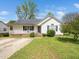 Charming single-story home featuring a cozy porch, landscaped front yard, and a classic white exterior at 104 Hamby Ct, Garner, NC 27529