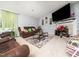 Comfortable living room featuring a fireplace, plush seating, and a TV for entertainment at 104 Hamby Ct, Garner, NC 27529