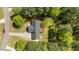 Aerial view of a home nestled amongst verdant trees and lush landscaping at 105 Coral Ridge Cir, Franklinton, NC 27525