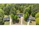 Aerial view of home nestled in a wooded area, highlighting the surrounding landscape and neighborhood at 105 Coral Ridge Cir, Franklinton, NC 27525