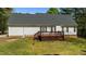 A backyard featuring a wooden deck and a well maintained yard at 105 Coral Ridge Cir, Franklinton, NC 27525