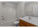 Bright bathroom featuring a shower-tub combo, single sink vanity, and a large mirror at 105 Coral Ridge Cir, Franklinton, NC 27525