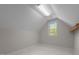 Bonus room with checkered flooring, a window with natural light and neutral walls at 105 Coral Ridge Cir, Franklinton, NC 27525