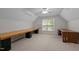 Spacious bonus room with neutral carpet, desk, and window with natural light at 105 Coral Ridge Cir, Franklinton, NC 27525