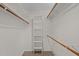 Large walk-in closet featuring built in shelving, hanging rods, and carpet at 105 Coral Ridge Cir, Franklinton, NC 27525