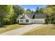 Charming home with an attached garage, well-maintained lawn, and inviting curb appeal at 105 Coral Ridge Cir, Franklinton, NC 27525